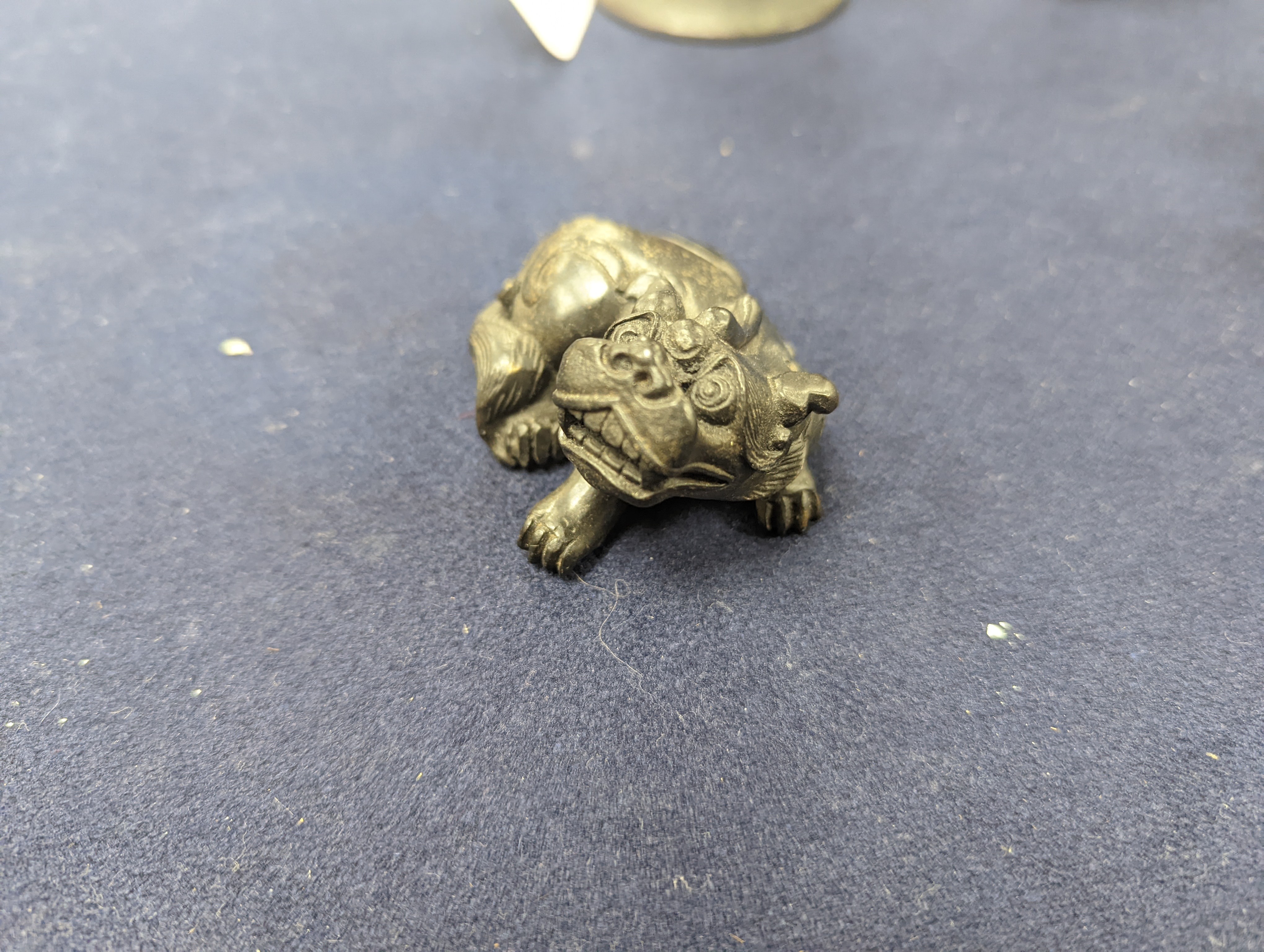 A Chinese gilt copper figure, a Chinese Dog of Fo, a bell, a censer, six Indian bronze figures and a scroll box